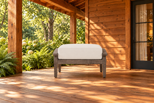 Lloyd Flanders Frontier Ottoman, sold individually, in an AI-styled warm cabin setting.