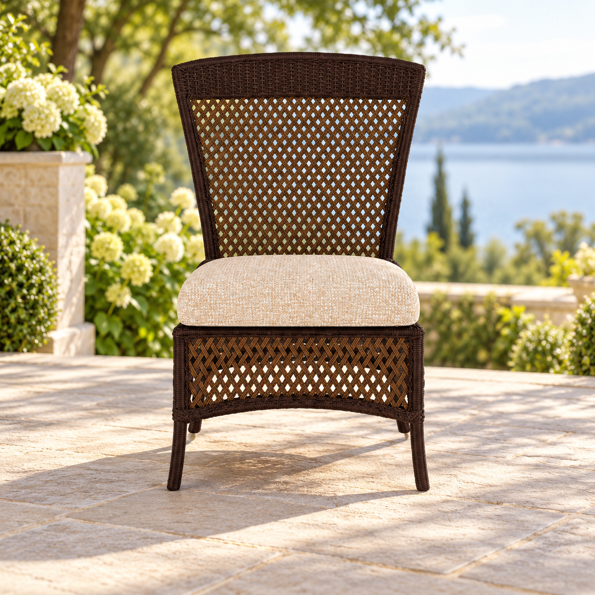 Lloyd Flanders Grand Traverse Armless Dining Chair on a lakeside garden terrace