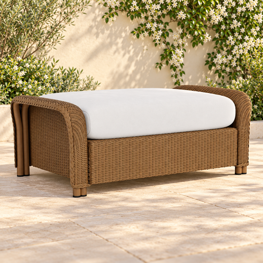 Lloyd Flanders Reflections Large Ottoman in an elegant flowering garden patio setting
