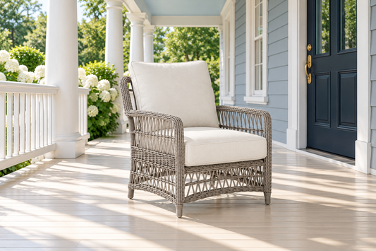 Lloyd Flanders Mackinac Lounge Chair, sold individually, in an AI-styled luxurious front-porch setting.