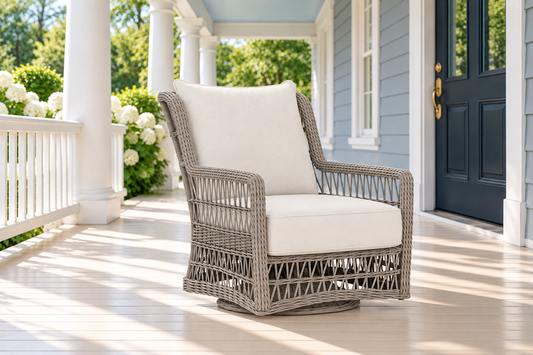 Lloyd Flanders Mackinac High Back Swivel Glider Lounge Chair, sold individually, in an AI-styled luxurious front-porch setting.