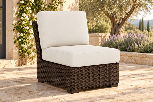 Lloyd Flanders Mesa Armless Sectional, sold individually, in an AI-styled garden setting with Pecan weave and Canvas Natural cushions.