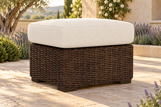 Lloyd Flanders Mesa Ottoman, sold individually, in an AI-styled garden setting with Pecan weave and Canvas Natural cushions.