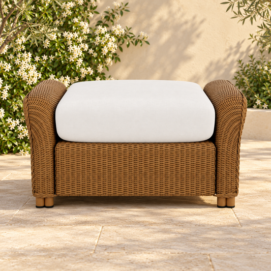 Lloyd Flanders Reflections Ottoman in an elegant flowering garden patio setting