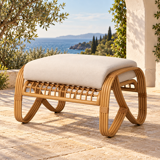 Lloyd Flanders Riviera Ottoman on a coastal villa terrace